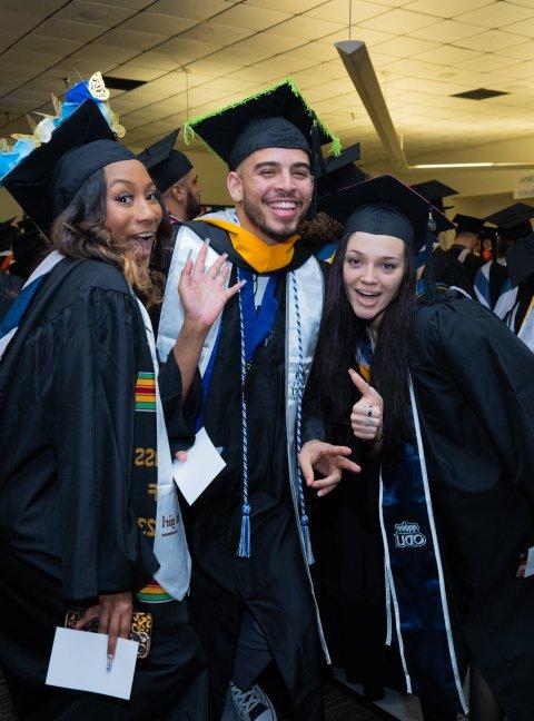 A group of students smile and pose together for a photo.