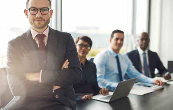 Professional sitting on desk