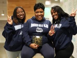 Three women wearing ODU sweatshirts.